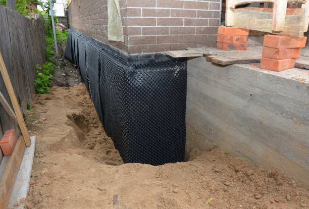 Happy homeowners after waterproofing job in McClure